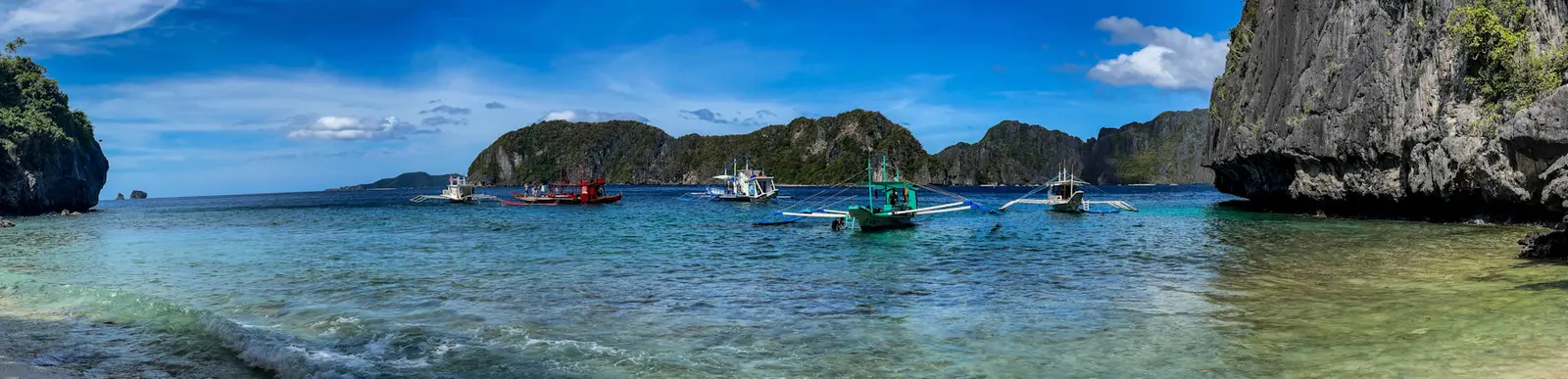 Limestone cliffs and boats near El Nido